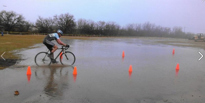 Alan Barton rides through one of the lake puddles.