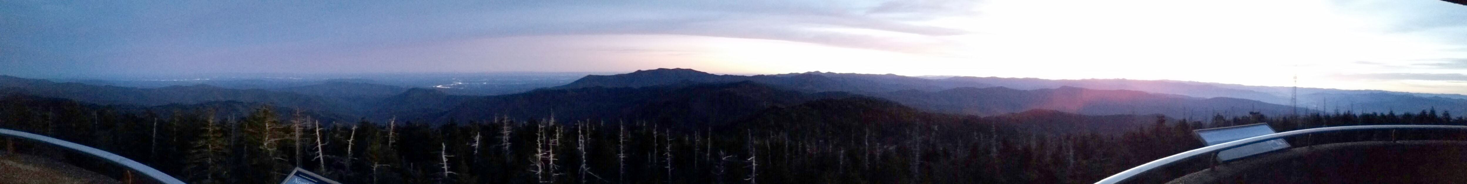 Panoramic photo from the Clingman's Dome tower overlook panning from northwest to the southeast with Mt Leconte prominent in the center and the Gatlinburg / Pigeon Forge area to its left.